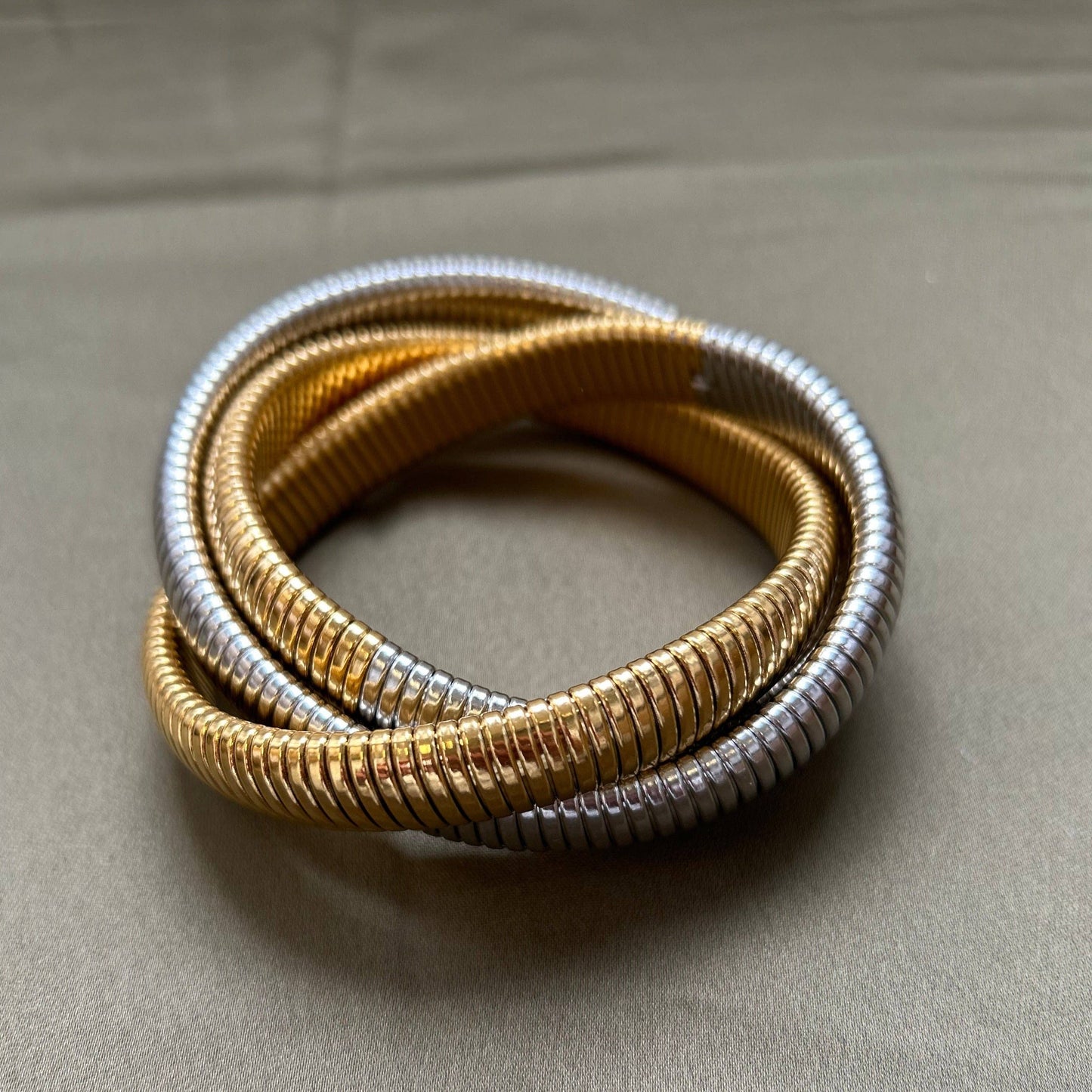 Two-tone snake chain bracelet with layered design