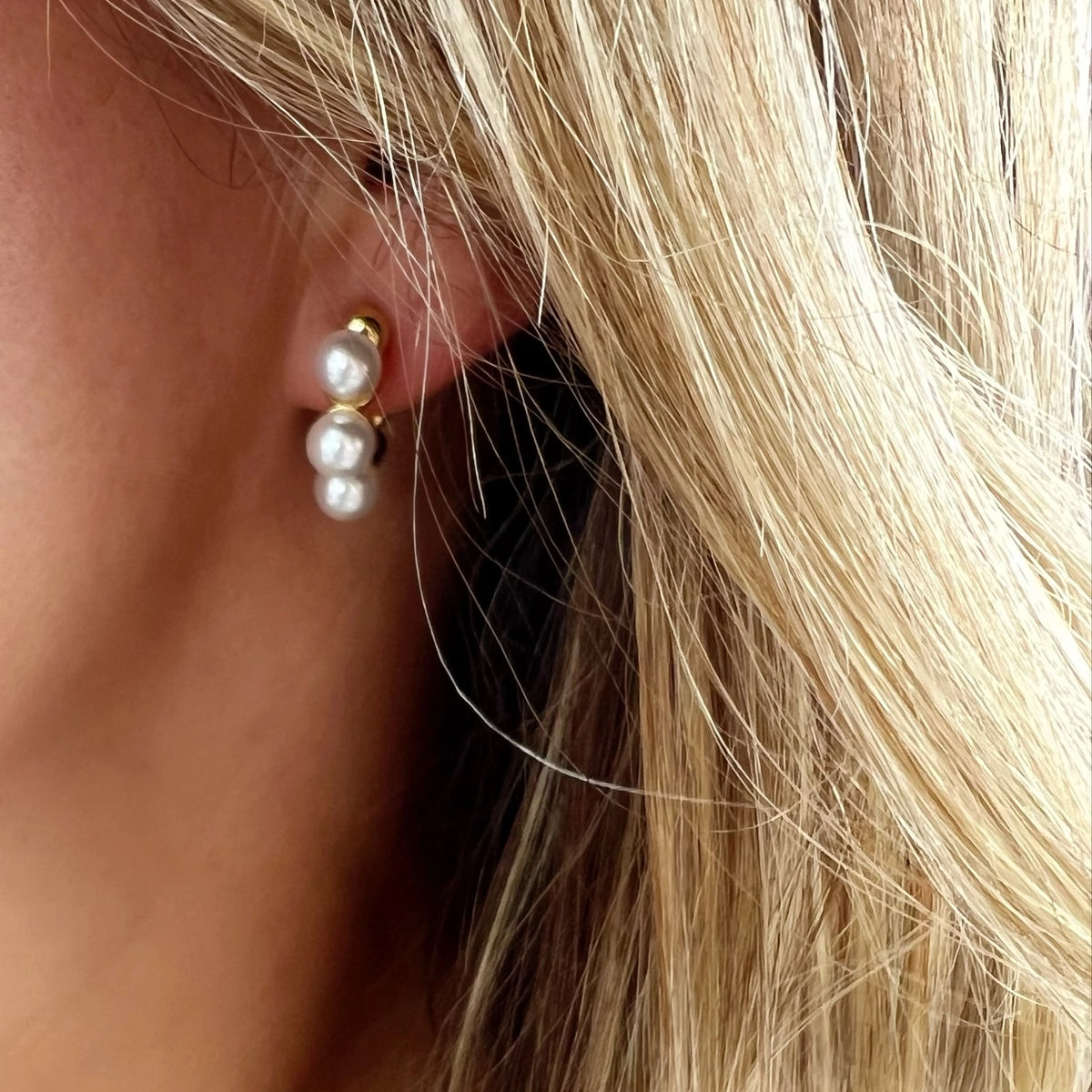 Close-up of pearl detail on lightweight 14K gold-filled hoop earrings