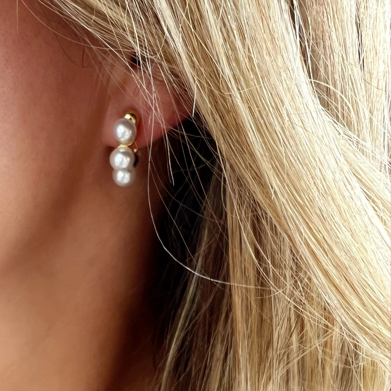 Close-up of pearl detail on lightweight 14K gold-filled hoop earrings