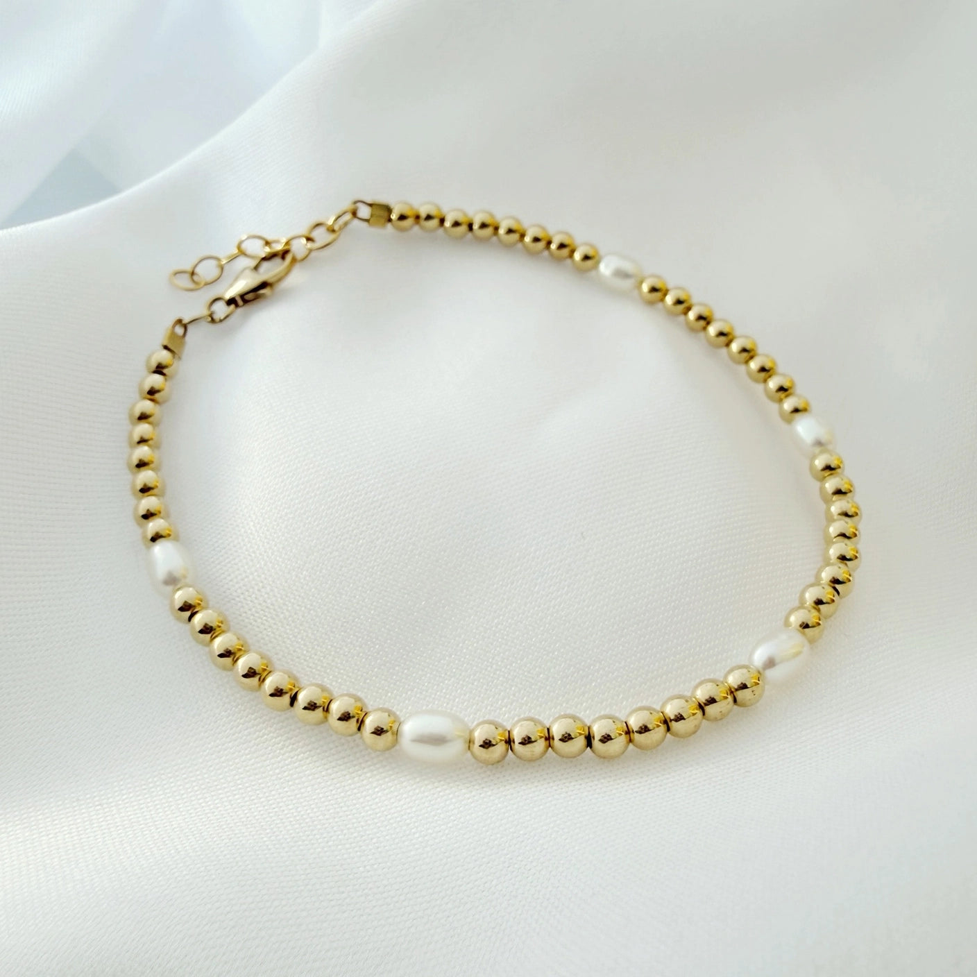 Adjustable freshwater pearl bracelet with gold-filled extender and findings