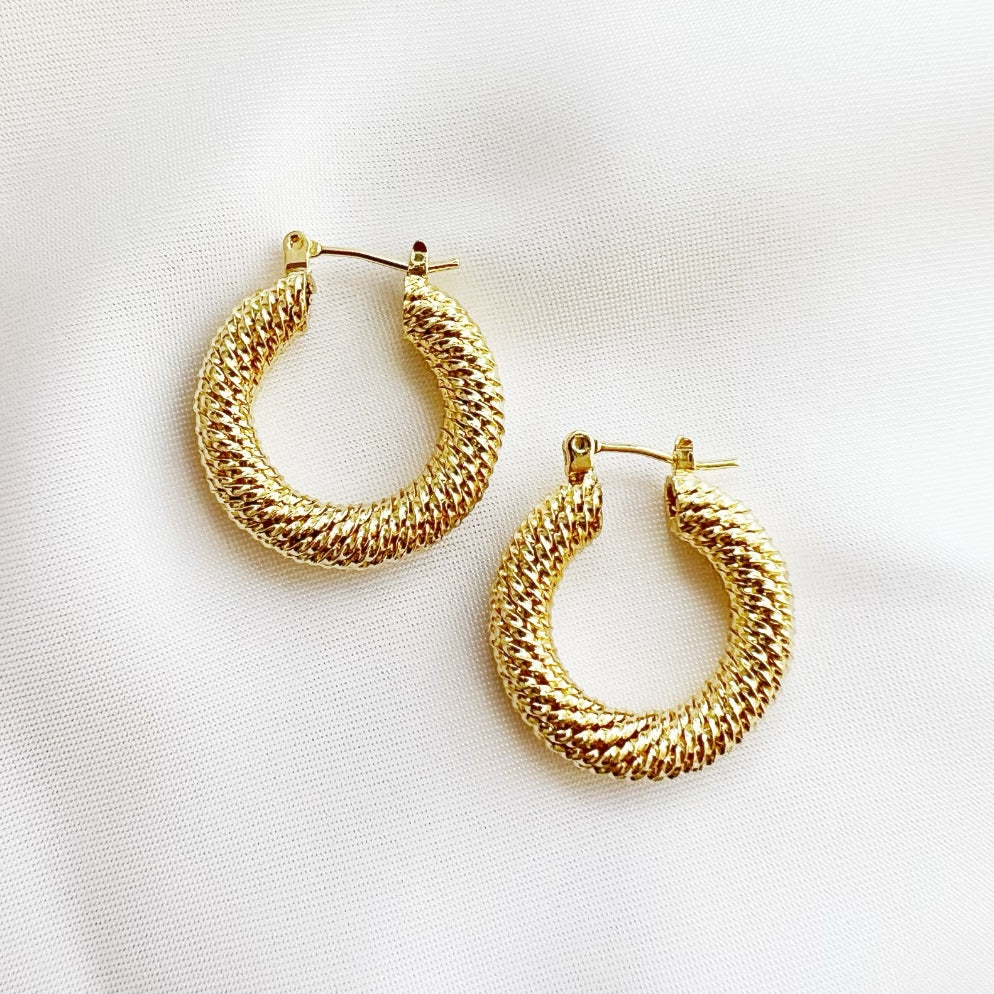 The Capri Twist Hoop Earrings featuring textured 14K gold-filled hoops