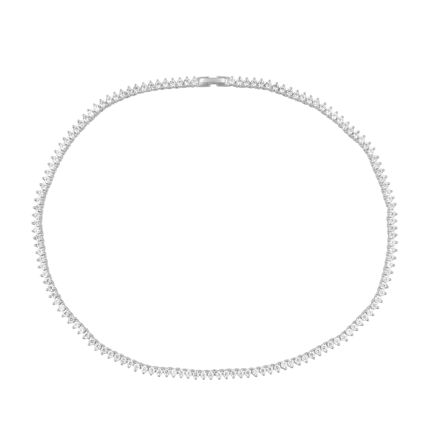 Close-up of clear cubic zirconia stones on silver tennis necklace