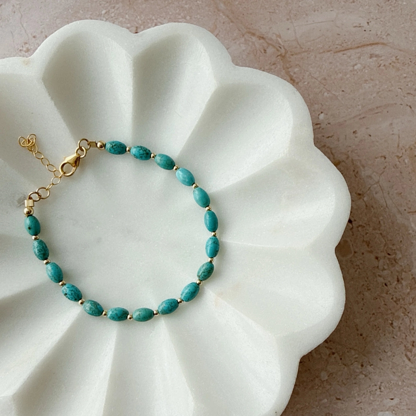 Close-up of genuine turquoise stones and 14K gold-filled beads on bracelet