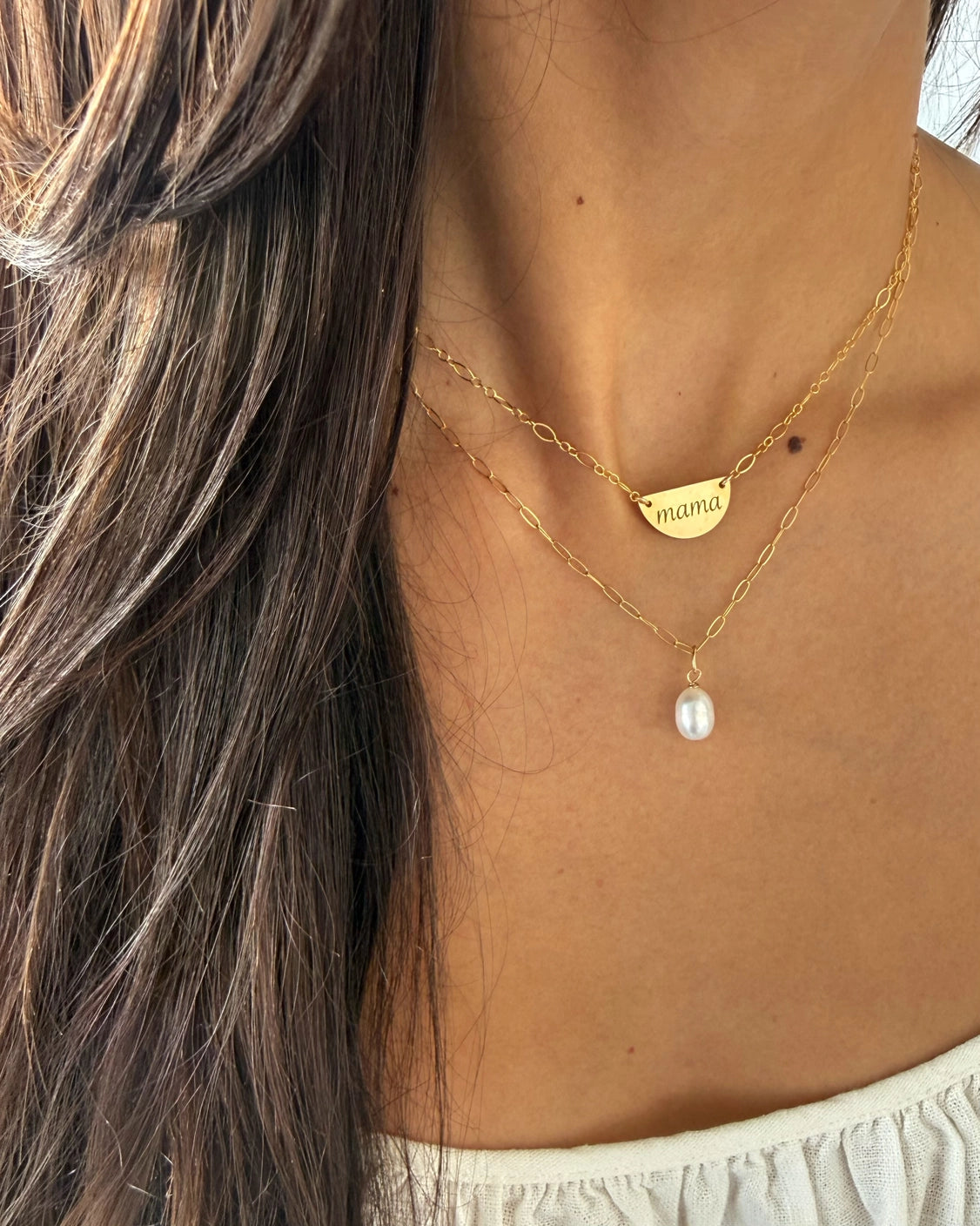 Close-up of genuine baroque pearl pendant on gold-filled paperclip chain necklace