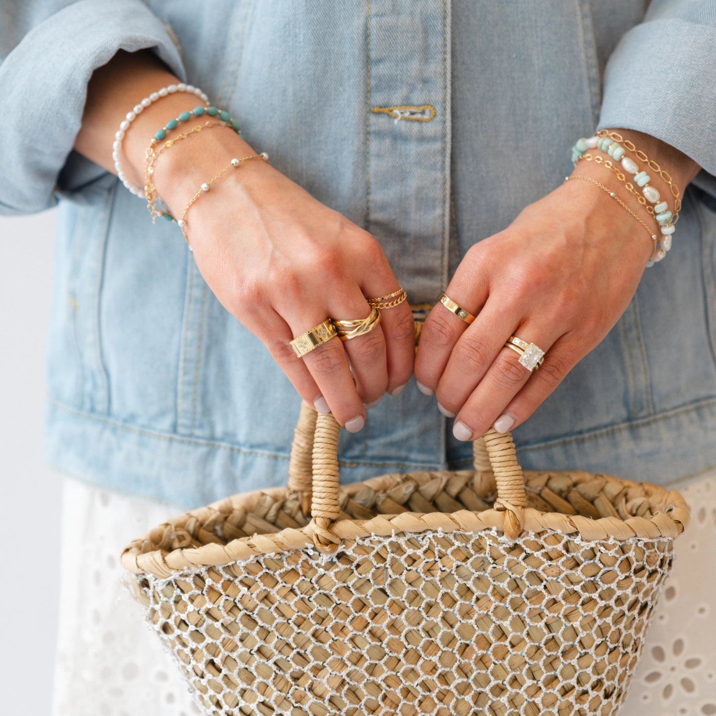 Turquoise bracelet stacked with gold jewelry for a coastal-inspired look
